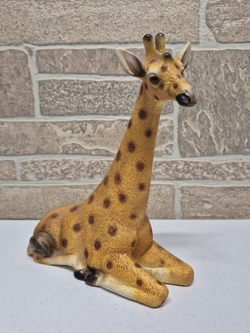 Ceramic Sitting Giraffe Figurine in Warm Yellow and Brown